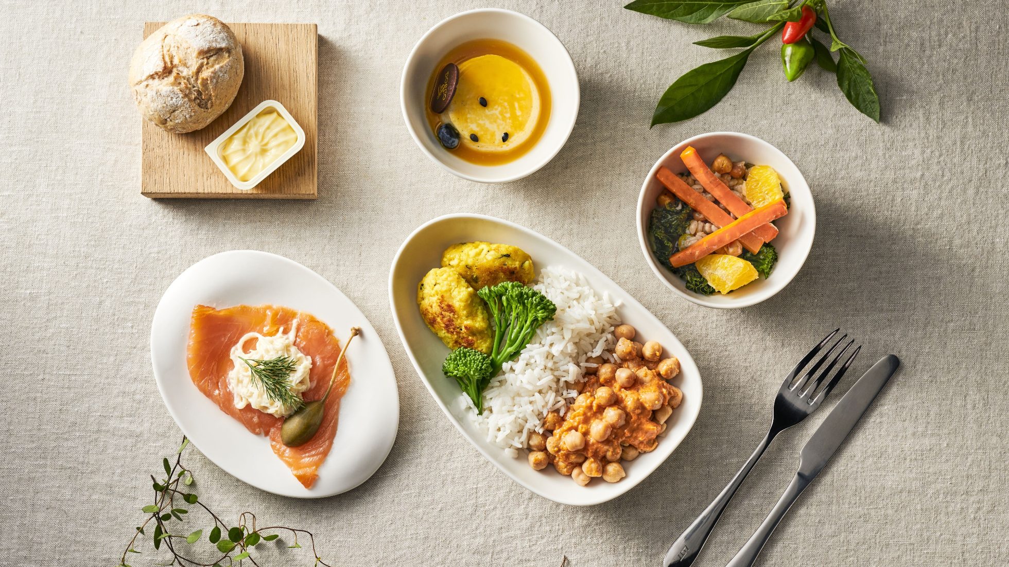 A meal served on an airplane is visible in the picture.